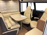 a table and chairs in the back of a camper