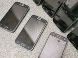 several cell phones are lined up on the floor next to each other