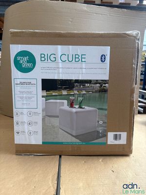 a box with a big cube inside of it on a table