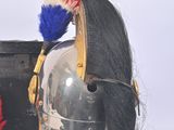 a helmet with a red, white, and blue mohawk on it
