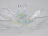 a glass bowl with a flower inside of it