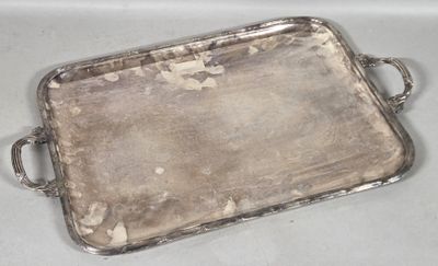a silver tray with handles on a table