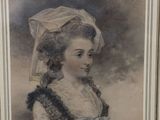 an old picture of a woman with a hat on her head