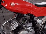 a red motorcycle that is parked in a parking lot