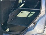 a car with the door open and the seat up