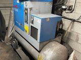 a machine that is sitting on a pallet in a garage