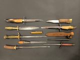many different types of knives on the table