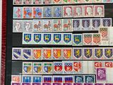 a close up of a picture of a book with stamps on it