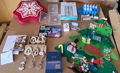 a table that has a bunch of christmas items on it