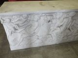 a marble sculpture of a group of people on a bench