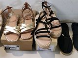 several pairs of shoes are lined up on a table