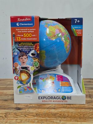 the globe is in the box on the table next to the box