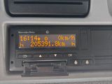 dashboard of a car with a digital clock showing the time