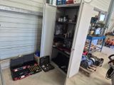 a garage with tools in it and a bike in the background