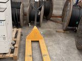 a pallet that is sitting next to a stack of wires