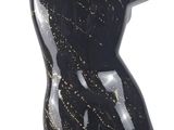 a black mannequin with gold paint on it
