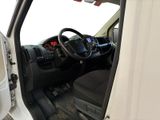 a white truck with the door open and the driver ' s seat down