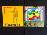 deux livres posés sur un tissu noir orné du dessin d'un homme tenant une guitare