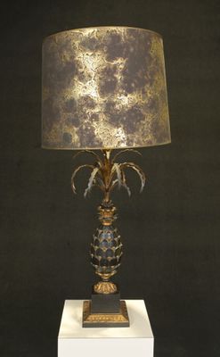a lamp that is sitting on a white pedestal