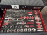 a tool box with tools in it sitting on a table