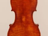 an old violin with a wooden back and a long neck