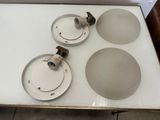 three lights that are sitting on top of a table