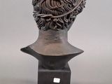 bronze bust of a man with a crown on his head