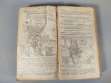 an old book with a map of a town on it