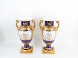 two vases that are sitting on top of each other
