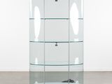 a glass display case with three shelves on each side of it