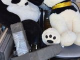 two stuffed animals that are sitting on a chair