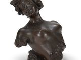 an image of a bronze sculpture of a woman ' s torso