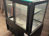an image of a glass display case in a warehouse