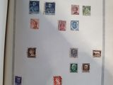 an open book with a picture of stamps on the pages
