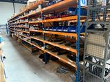 many shelves with various items in them in a warehouse