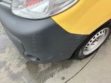 a close up of a yellow and black car parked on the side of the street