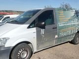 a van that is parked on the side of the road