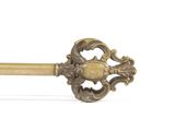 a gold key that is sitting on a white surface