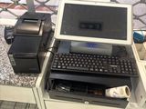 a laptop computer sitting on a desk with a printer on it
