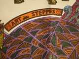 an elephant that is standing in front of a sign