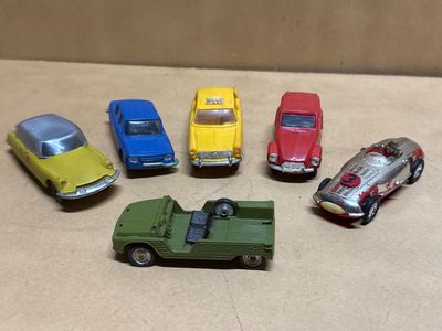 several toy cars are lined up in a circle on a table