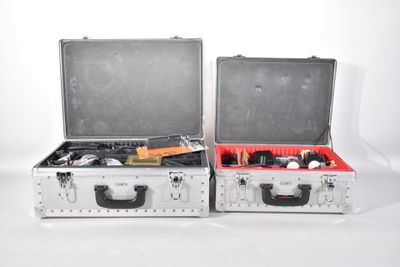 two suitcases that are sitting side by side on a white surface