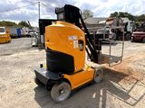 a yellow machine that is sitting in the dirt