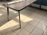 a table with a ruler on it in front of a window