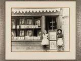 a black and white photo of a woman and a child in front of a book store