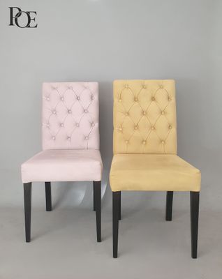 two chairs that are sitting next to each other in a room