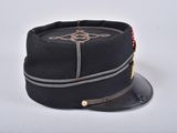 a black hat with a gold emblem on it