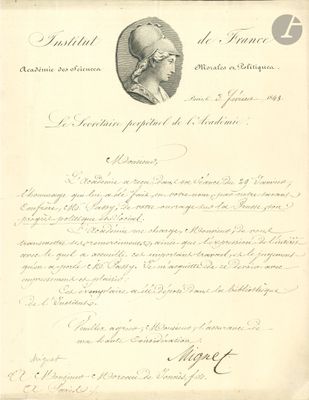 un vieux document sur lequel figure la photo d'un homme portant un turban