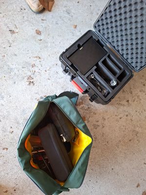 a suitcase with a gun inside of it sitting on the floor