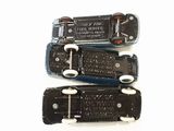 four different types of luggage tags on a white surface